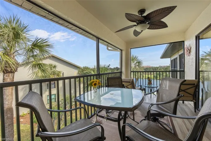 Back lanai that extends across the length of the unit & overlooks water & golf course.