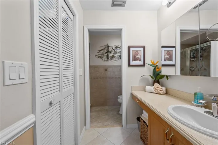 Primary bath with separate area for toilet & shower.
