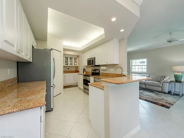 Lots of storage in this kitchen area that opens to the living and dining areas.