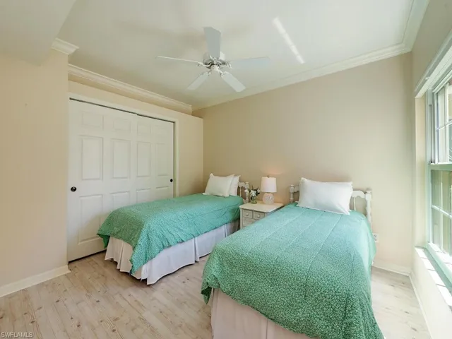 This cheery bedroom has a nice size closet for guests.