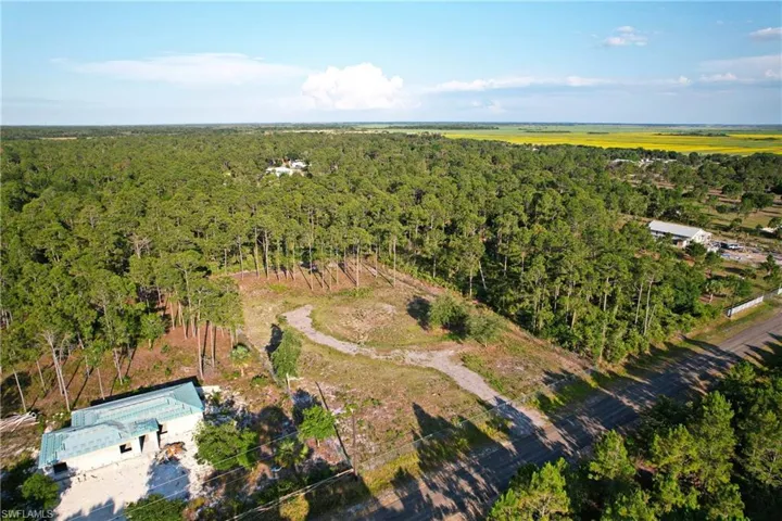 Birds eye view of property with a rural view