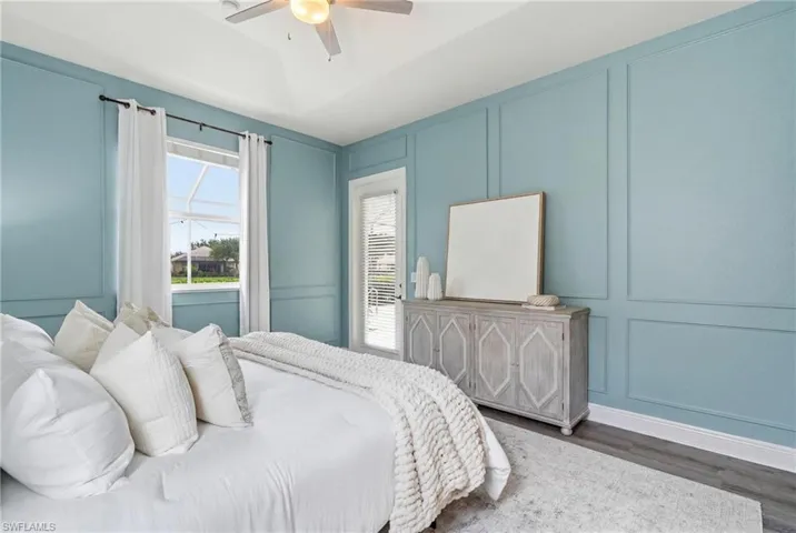 Vaulted ceiling with a ceiling fan and light fixture