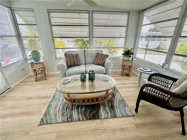 Florida Room renovated w/flooring, ceiling, blinds, insulation & AC window unit