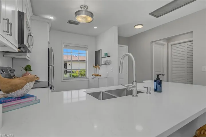 This Kitchen remodel includes new appliances, soft close shaker style cabinetry, deep sink, coffee station or just extra storage, QUARTZ countertops, new hardware, faucets, trim, vinyl flooring and new lighting make this Kitchen dreamy!