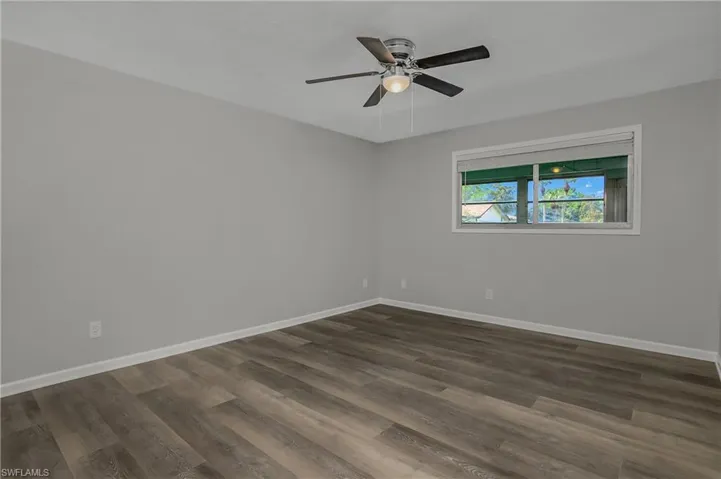 Generous sized Bedroom with new laminate flooring, ceiling fan, trim and doors!