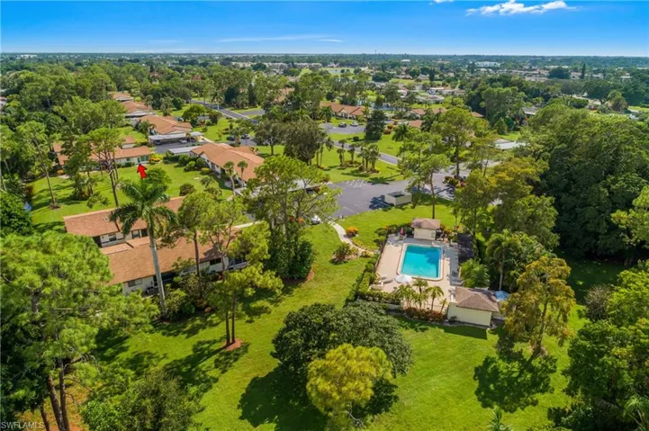 Lush green foliage and Pines line this entire community