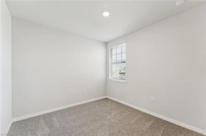 Spare room with carpet floors