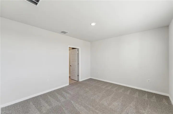 Spare room featuring carpet floors
