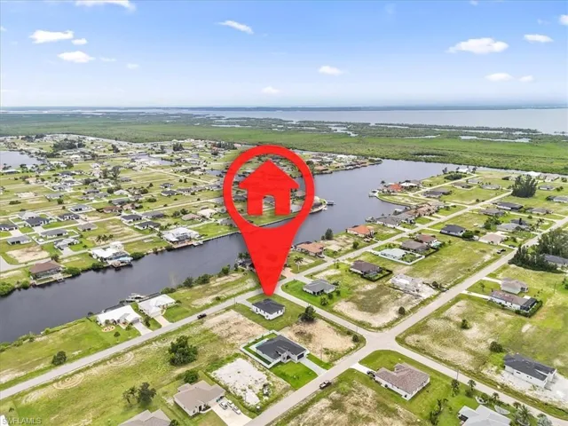 View of property location featuring nearby suburban area and a large body of water