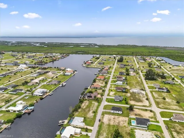 Aerial perspective of suburban area with a large body of water