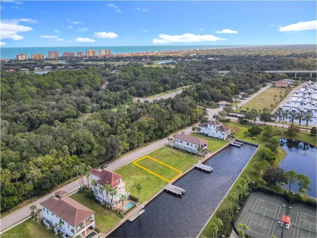 Aerial overview of property's location featuring a nearby body of water and property boundaries highlighted
