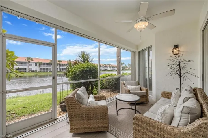 Lanai with a water view, ceiling fan, and an outdoor hangout area