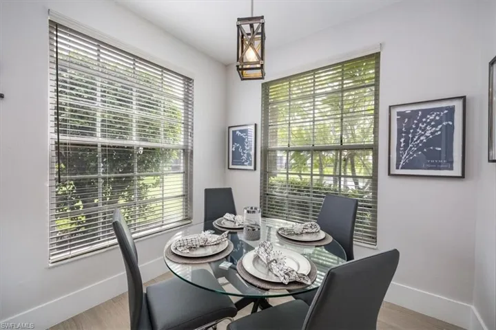 Dining area with baseboards and light wood finished floors