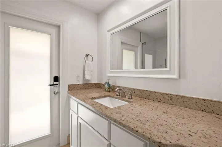 Full bathroom featuring vanity and a shower