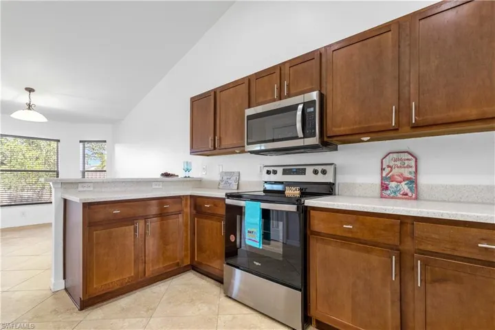 Spacious kitchen with new countertop and stainless appliances