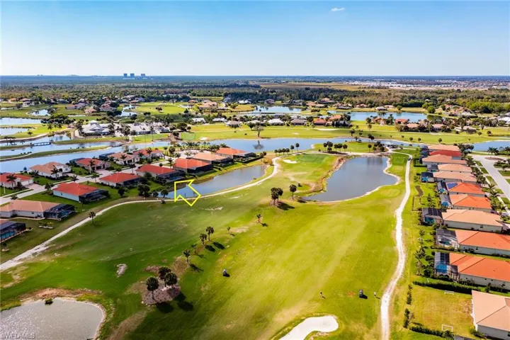 Bird's eye view featuring view of golf course, a water view, and a residential view