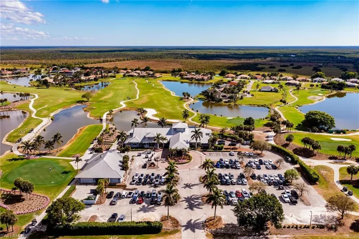 Bird's eye view featuring golf course view and a water view