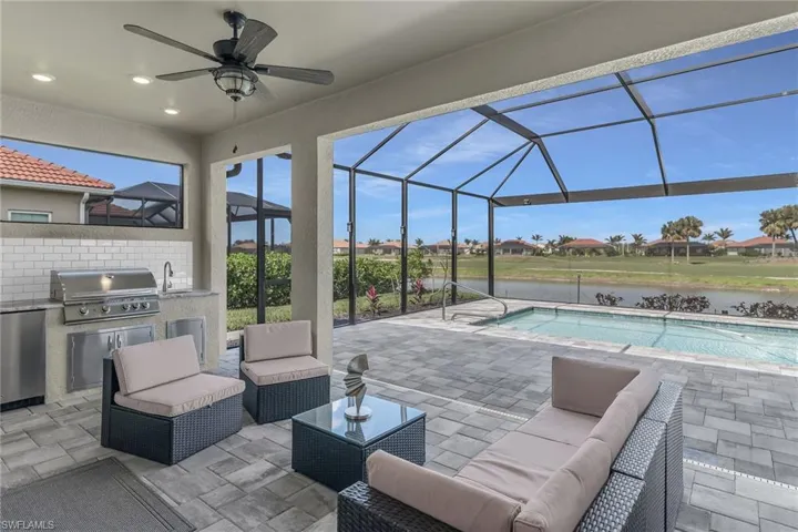 View of patio / terrace featuring a sink, outdoor lounge area, area for grilling, and a grill
