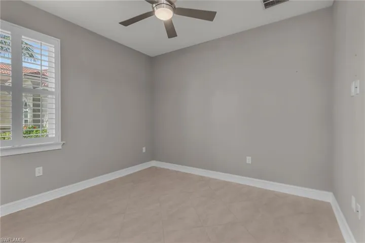 Bedroom featuring a ceiling fan, a wealth of natural light