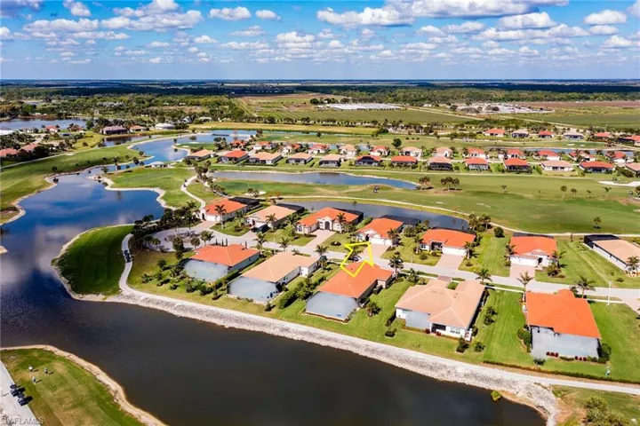 Bird's eye view featuring view of golf course, a water view, and a residential view