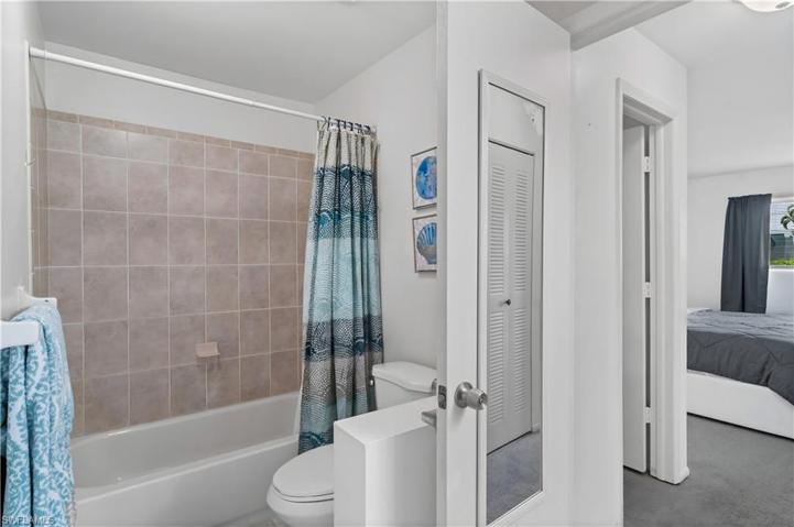 Bathroom offers a shower/tub combo.