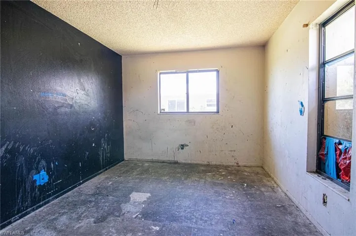 Spare room with a textured ceiling