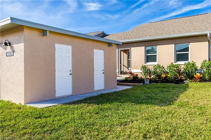 Separate storage room with property and a yard.  Door on the left is for unit #703.