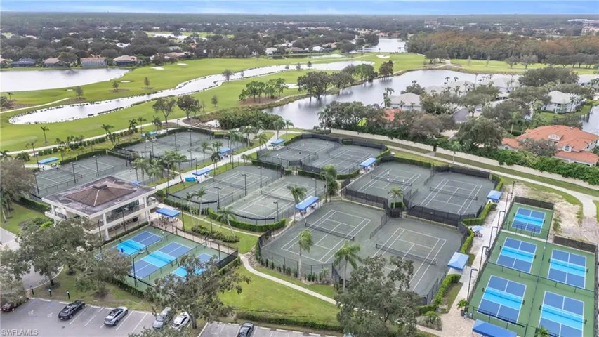 Birds eye view of property with a water view