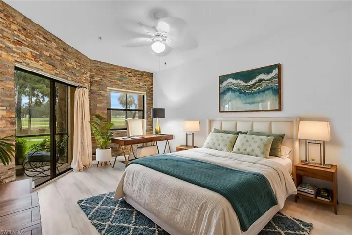 Bedroom with ceiling fan, access to outside, and light hardwood / wood-style flooring
