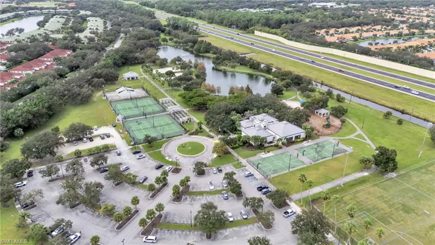 Birds eye view of property with a water view