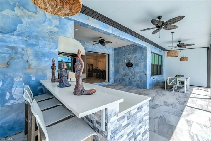 View of patio with a ceiling fan