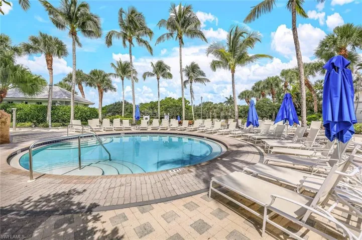 Community pool featuring a patio