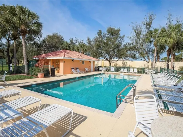 Community pool featuring a patio