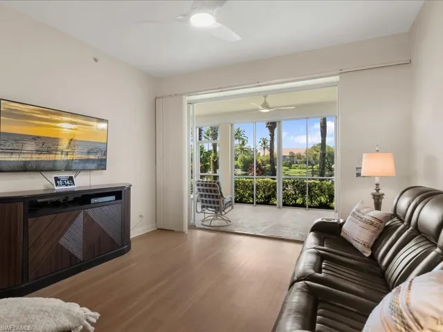 Living room featuring wood finished floors and baseboards