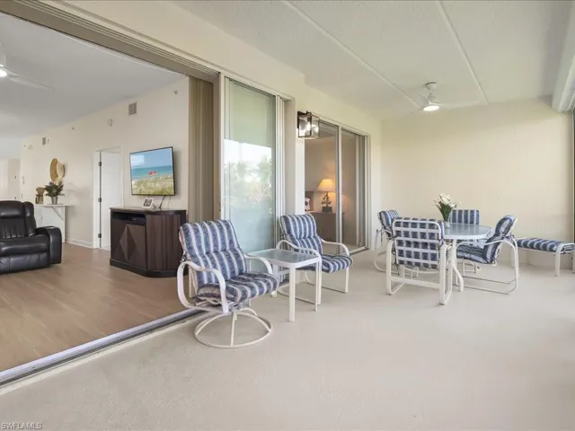 View of patio with ceiling fan and outdoor dining area