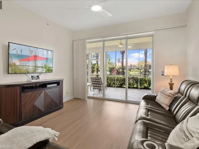 Living area featuring wood finished floors and baseboards