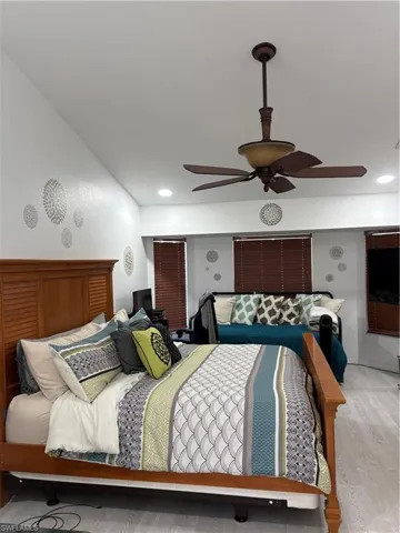 Bedroom with wood finished floors and a ceiling fan