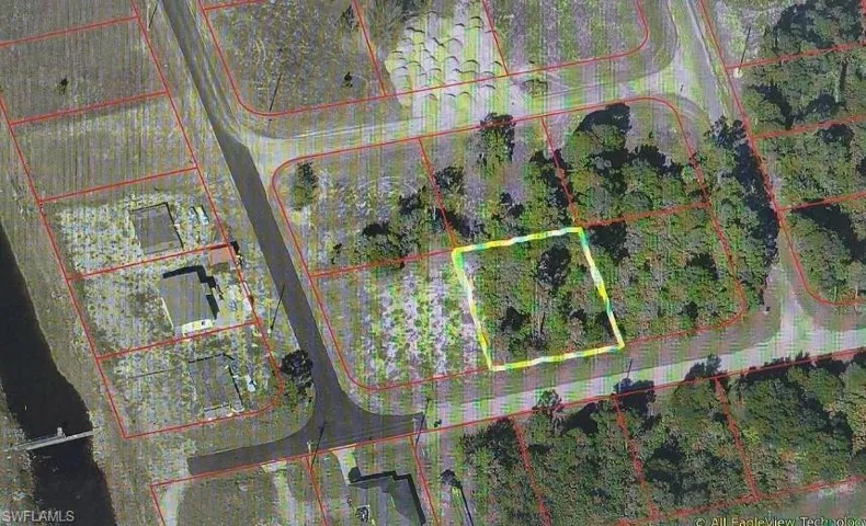 Aerial overview of property's location with property parcel outlined