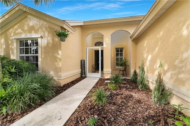 Property entrance with stucco siding