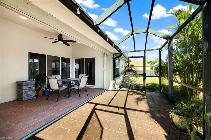 Sunroom featuring ceiling fan
