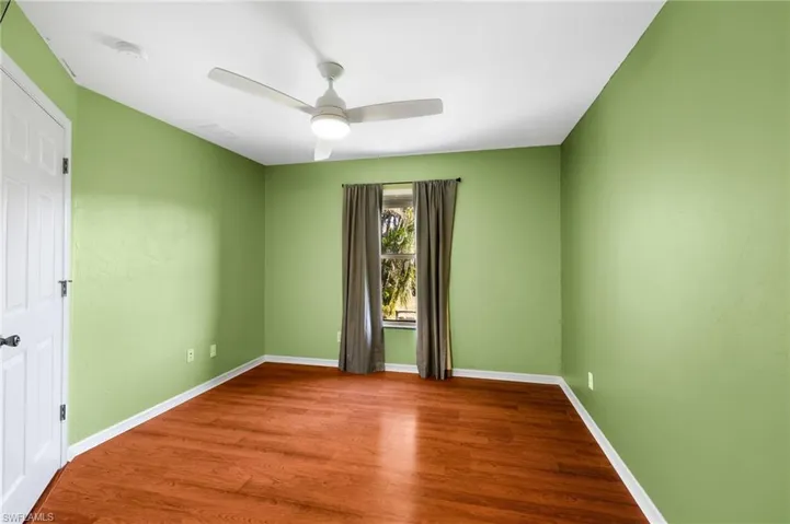Spare room with ceiling fan and hardwood / wood-style floors