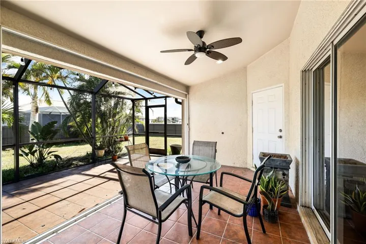 Sunroom with ceiling fan and lofted ceiling