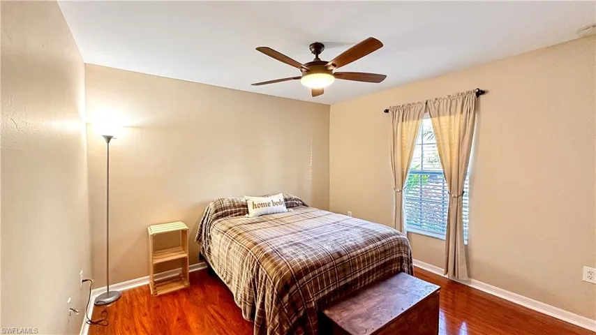 Bedroom featuring hardwood / wood-style floors and ceiling fan