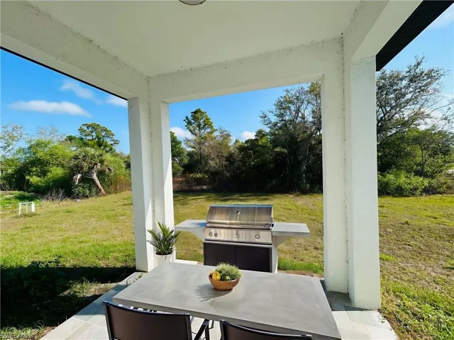 Virtually stage view of patio featuring a grill