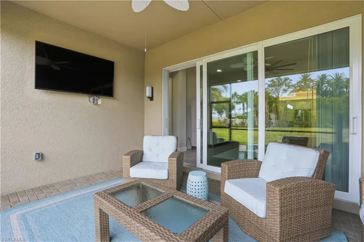 View of patio featuring a ceiling fan