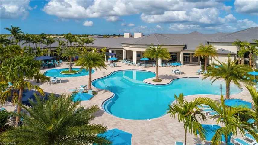 Community pool with a patio