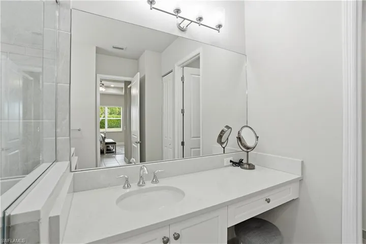 Full bathroom featuring vanity and ensuite bathroom