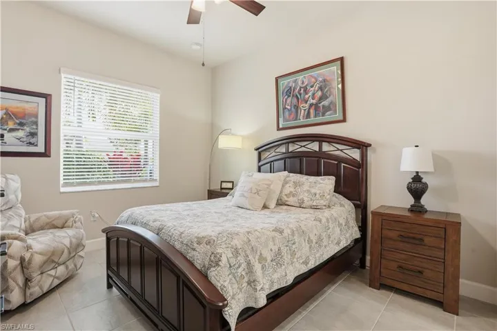 Bedroom featuring a ceiling fan and light tile patterned floors