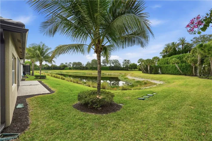 View of green lawn with a water view