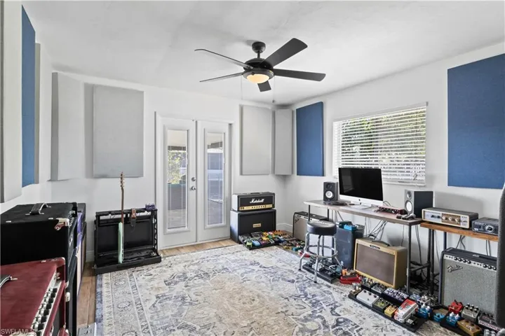 The guest bedroom-turned-den has been thoughtfully transformed into a comfortable and versatile space, with a French door that opens directly to the backyard.